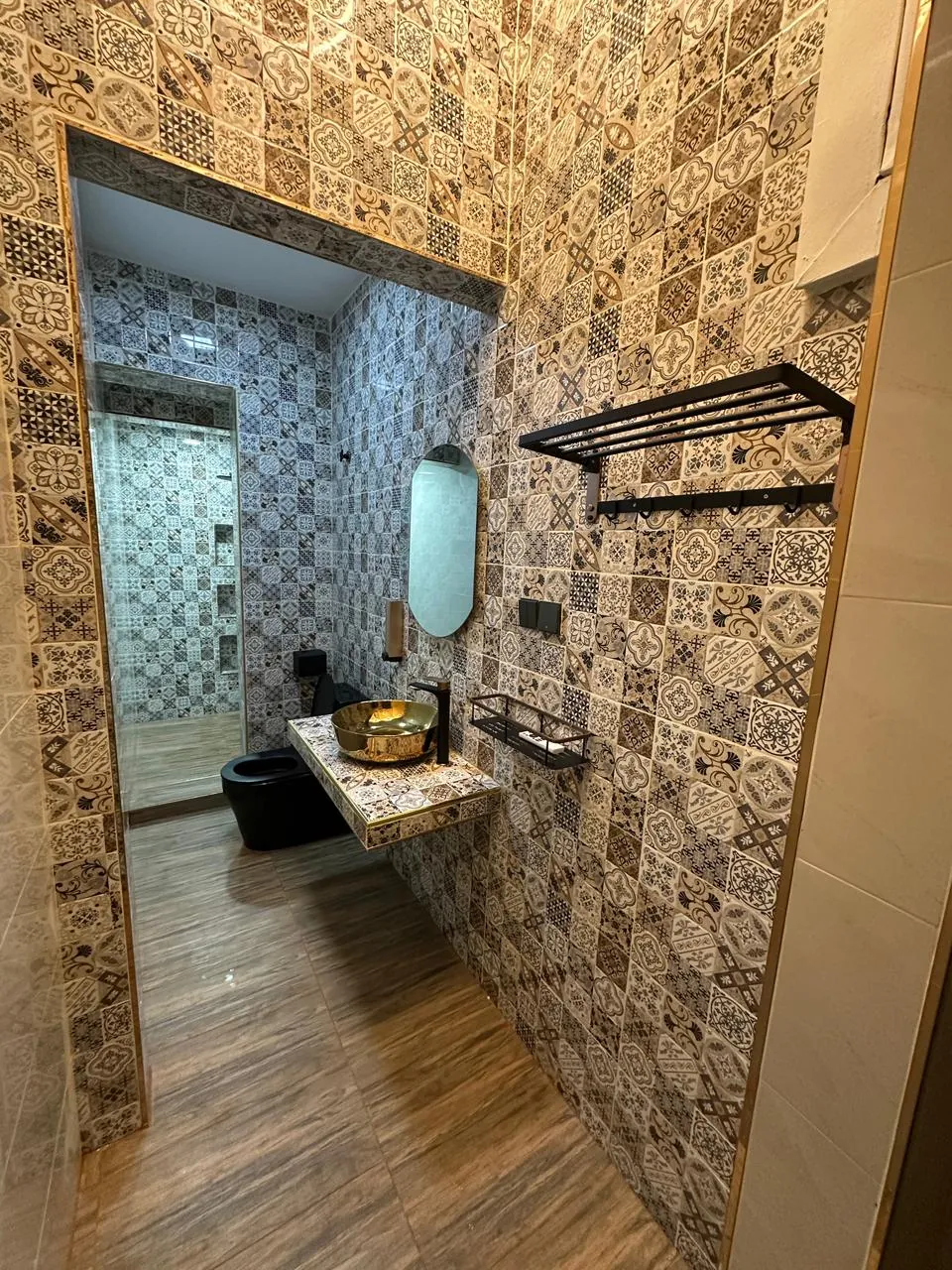 Completed patterned tile renovation in a bathroom