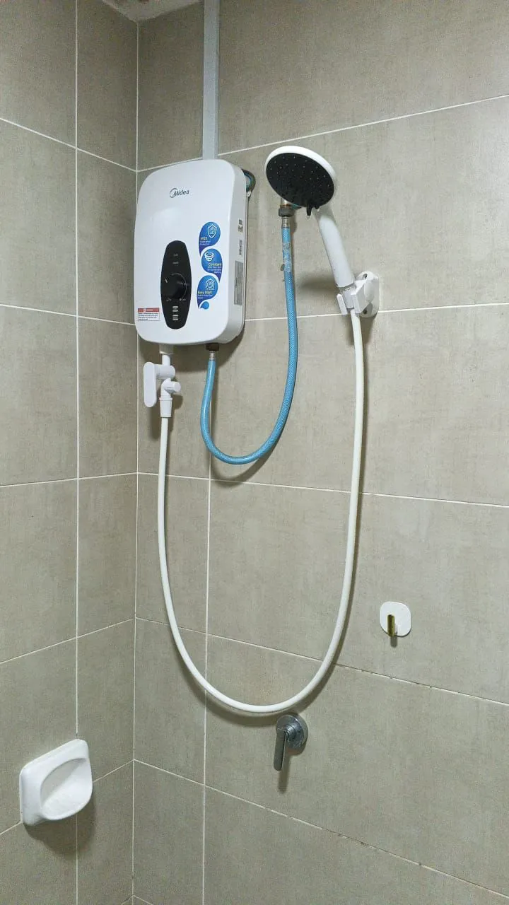 Bathroom water heater installed with connected fittings